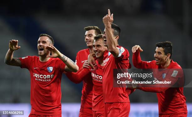 Robert Tesche of VfL Bochum 1848 celebrates after scoring their team's first goal with Anthony Losilla and Maxim Leitsch during the Second Bundesliga...