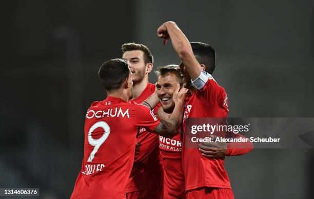 Robert Tesche of VfL Bochum 1848 celebrates after scoring their team's first goal with Anthony Losilla and Simon Zoller during the Second Bundesliga...