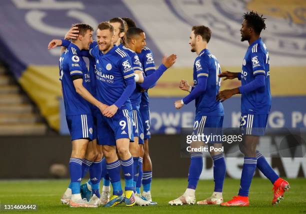 Timothy Castagne of Leicester City celebrates after scoring their team's first goal with Jamie Vardy during the Premier League match between...