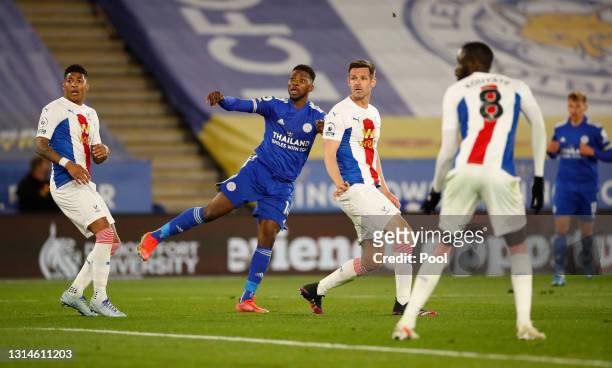 Kelechi Iheanacho of Leicester City scores their team's second goal past Patrick van Aanholt and Scott Dann of Crystal Palace during the Premier...