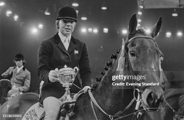 English show jumping champion Ann Moore holding a trophy, UK, 13th October 1973.