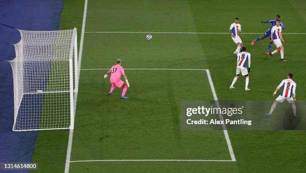 Kelechi Iheanacho of Leicester City scores their team's second goal past Patrick van Aanholt and Scott Dann of Crystal Palace during the Premier...