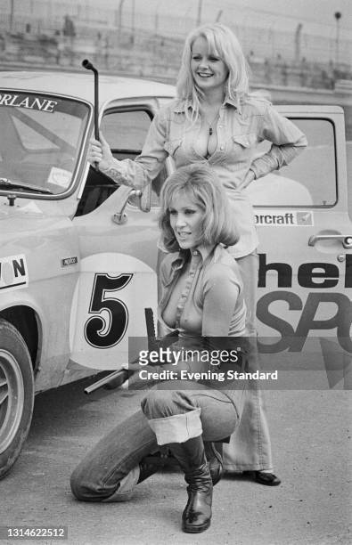 Actresses Linda Cunningham and Fiona Richmond take part in the Shellsport Escort Ladies' Championship at Brands Hatch, UK, 29th March 1974.