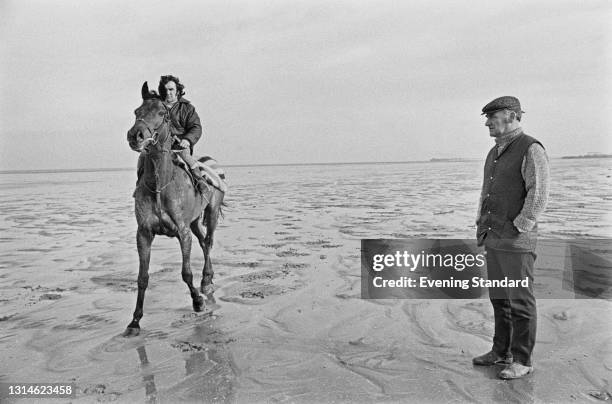 Thoroughbred racehorse Red Rum training on the beach at Birkdale, Southport, for the 1974 Grand National at Aintree, UK, March 1974. He won the race...