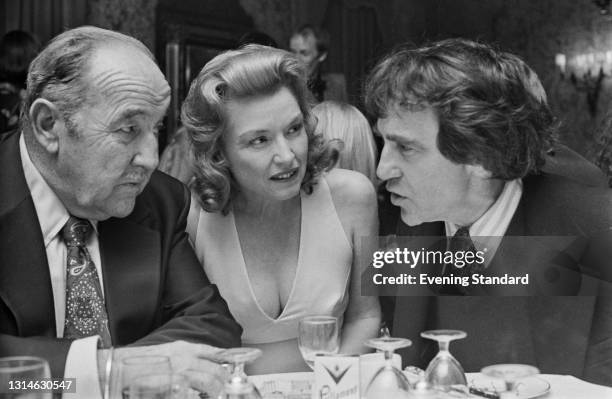 From left to right, actors Broderick Crawford , his wife Mary Alice, and American theatrical producer Joseph Papp in London, UK, 9th May 1974....