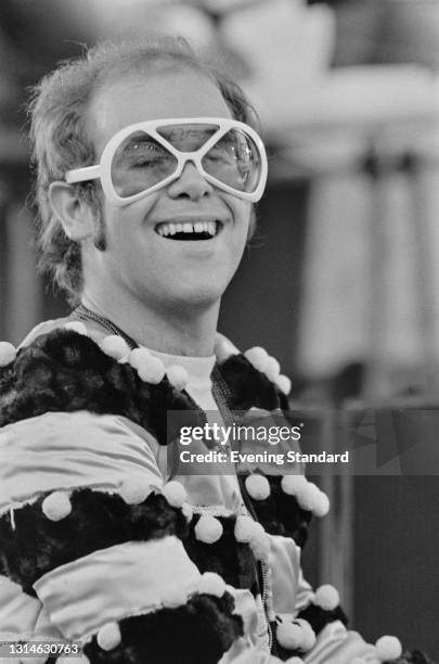 English singer and pianist Elton John performs at a benefit concert for Watford FC at the club's Vicarage Road stadium, Watford, UK, 5th May 1974.