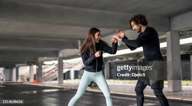 young athletic couple practicing boxing skills. - the way of the fight stock pictures, royalty-free photos & images