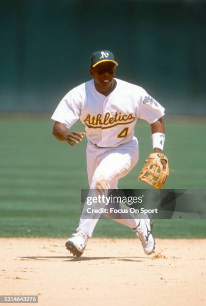 Miguel Tejada of the Oakland Athletics reacts to field the ball during an Major League Baseball game circa 2001 at the Oakland-Alameda County...