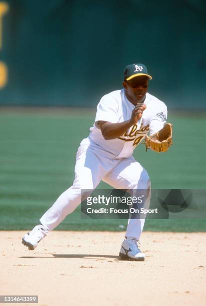 Miguel Tejada of the Oakland Athletics reacts to field the ball during an Major League Baseball game circa 2001 at the Oakland-Alameda County...