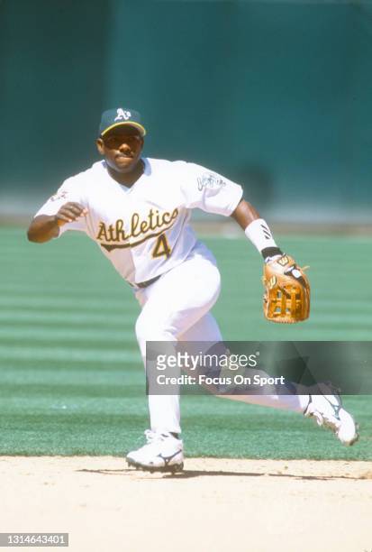 Miguel Tejada of the Oakland Athletics reacts to field the ball during an Major League Baseball game circa 2001 at the Oakland-Alameda County...