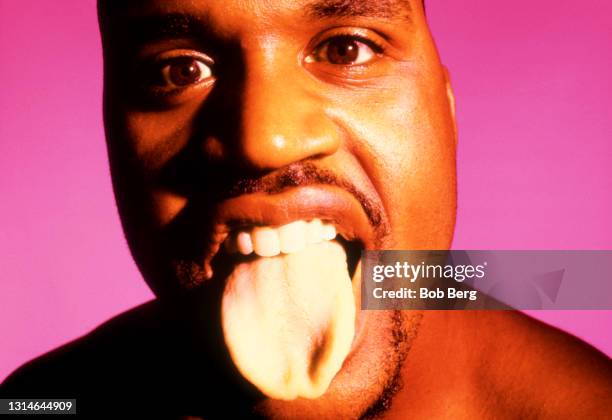 Basketball player Shaquille O'Neal of the Los Angeles Lakers poses for a portrait with his tongue sticking out circa October, 1999 in Los Angeles,...