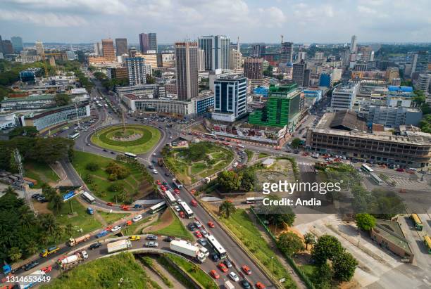 Cote d'Ivoire , Abidjan: aerial view of the business district of Le Plateau. Office buildings and traffic in 'place de la Republique' square.