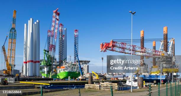 Installation vessels Apollo and Vole Au Vent moored at REBO heavy load terminal in Ostend port, Belgium loading wind turbines for SeaMade wind farm.