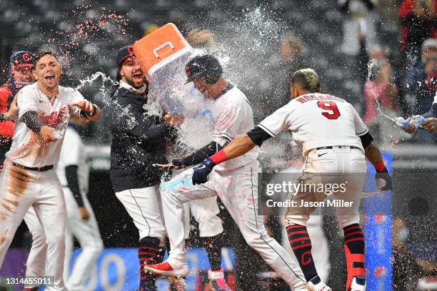 Jordan Luplow of the Cleveland Indians celebrates with his teammates after hitting a walk-off two run home run during the tenth inning against the...