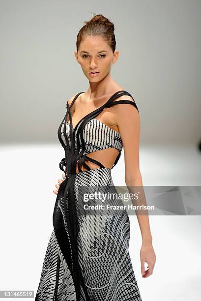 Model walks the runway during the Nicolas Felizola show at ARUBA IN STYLE 2011 - Venezuelan Group Show on November 4, 2011 in Oranjestad, Aruba.