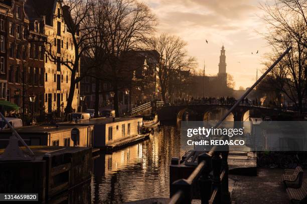 Reflections of Amsterdam's traditional buildinds on canals, Amsterdam, the Netherlands, Europe.