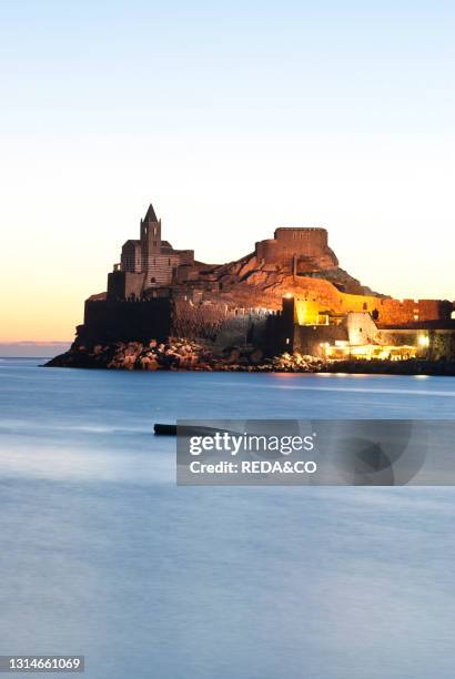 Sunset on the church of San Pietro, perched on a rocky spur of the promontory of the Bocche di Porto Venere, is the oldest vestigial church in the...