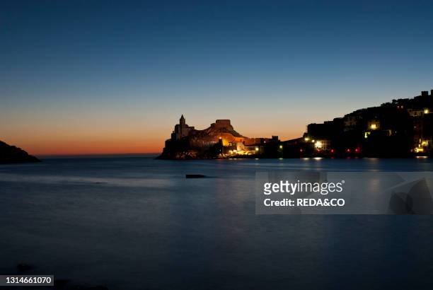 Sunset on the church of San Pietro, perched on a rocky spur of the promontory of the Bocche di Porto Venere, is the oldest vestigial church in the...