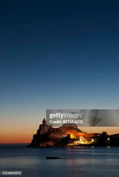 Sunset on the church of San Pietro, perched on a rocky spur of the promontory of the Bocche di Porto Venere, is the oldest vestigial church in the...