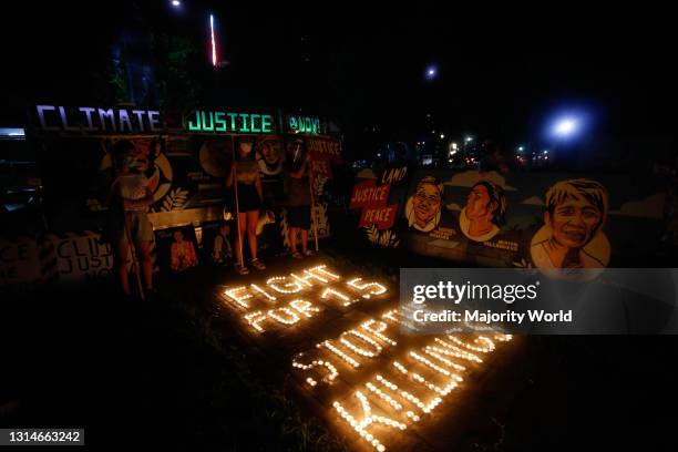 Climate activists lit candles and held LED lighting banners on December 11th 2020. This activity commemorates the five year anniversary of the Paris...