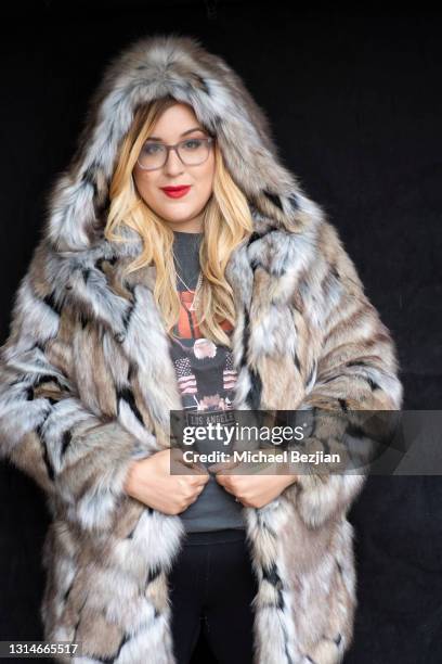 Celebrity Love Coach Nicole Moore poses for portrait wearing Spirit Hoods fur and Jimeye Designs jewelry at The Artists Project Host Wadjet PR &...