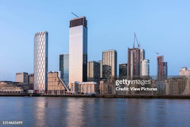 View across Thames from west at sunset. Isle of Dogs, London, United Kingdom. Architect: Various, 2020.