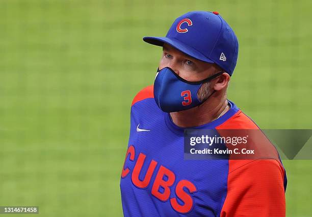 David Ross of the Chicago Cubs walks to the dugout after a pitching change in the fourth inning against the Atlanta Braves at Truist Park on April...