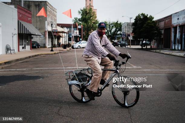 Man rides his bike on April 26, 2021 in Clarksdale, Mississippi. So far, 23 percent of Mississippians are fully vaccinated, and the Mississippi State...