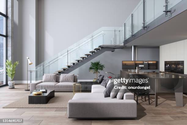 luxury living room with sofa, open plan kitchen and staircase. - loft interior imagens e fotografias de stock