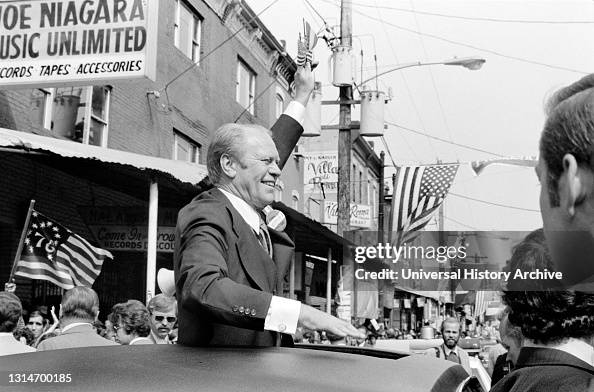 U.S. President Gerald Ford waves to crowd from the sunroof of a car in Philadelphia, Pennsylvania, USA, Marion S. Trikosko, September 1976