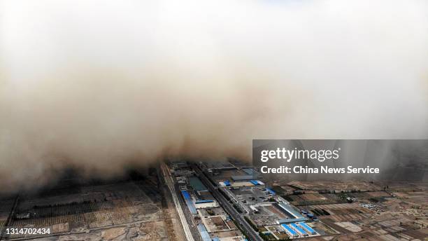 Aerial view of a sandstorm engulfing Linze county on April 25, 2021 in Zhangye, Gansu Province of China.