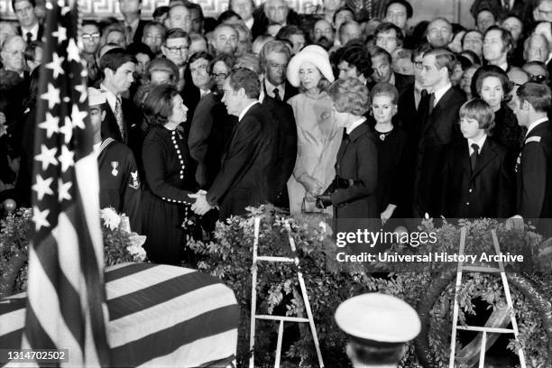 President speaking with Claudia "Lady Bird" Johnson during former U.S. President Lyndon Johnson's Funeral inside Capitol Building, Washington, D.C.,...