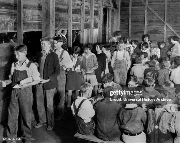 American Red Cross Volunteers cooking and serving Lunch to Rural Schoolchildren, all Drought Victims, Lonoke County, Arkansas, USA, Lewis Wickes...