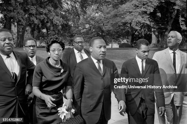 Ralph Abernathy , Martin Luther King, Jr. , John Lewis with group of people leaving White House after meeting with U.S. President Lyndon Johnson,...