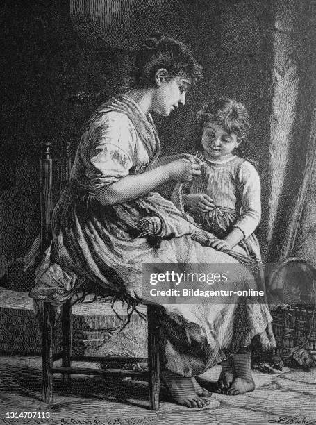 Woman doing needlework, showing her daughter how to knit and crochet / Frau bei der Handarbeit, zeigt ihrer Tochter das Stricken und Häkeln,...