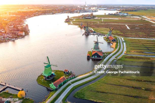 aerial photo of the windmills at zaanse schans at sunset - amsterdam dusk evening foto e immagini stock