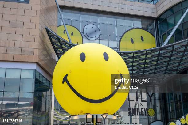 Smiley balloons are set up to advertise a Smiley Hour Pop-up store at a shopping mall on April 26, 2021 in Shanghai, China.