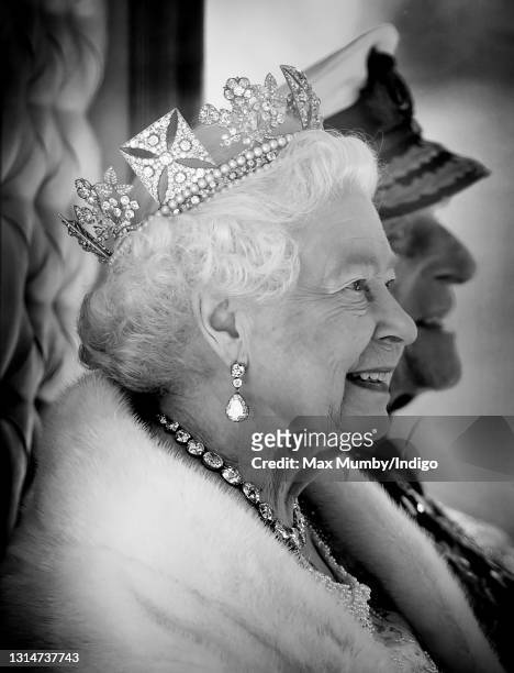 Queen Elizabeth II , accompanied by Prince Philip, Duke of Edinburgh, travels down The Mall in the Diamond Jubilee State Coach after attending the...