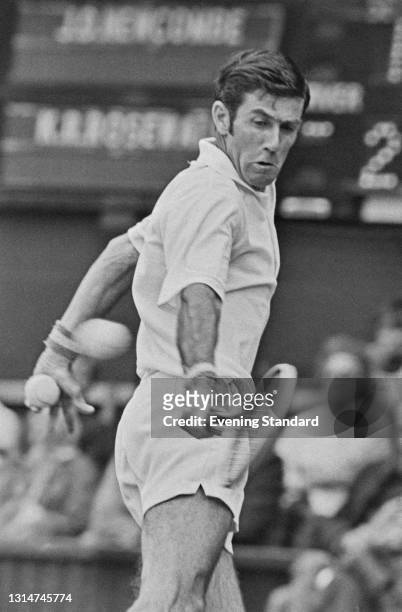 Australian tennis player Ken Rosewall takes on Australia's John Newcombe in the quarterfinals of the Men's Singles at the Wimbledon Championships in...