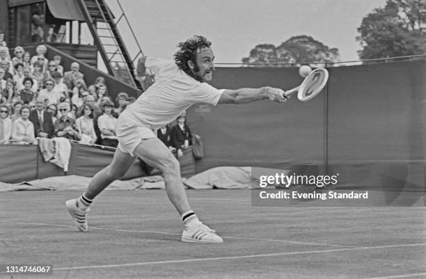 Australian tennis player John Newcombe during the Wimbledon Championships in London, UK, June 1974. He reached the quarterfinals of the Men's Singles.