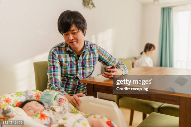 Dad Rocking Baby Photos and Premium High Res Pictures - Getty Images