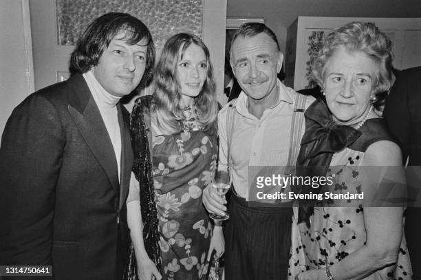From left to right, pianist and conductor André Previn , his wife, American actress Mia Farrow, English actor John Mills and his wife Mary Hayley...