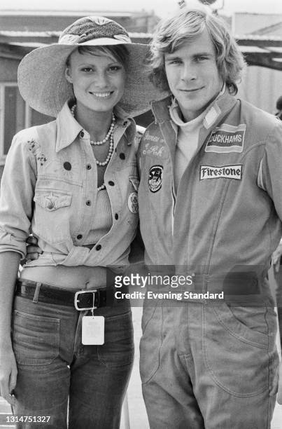 British racing driver James Hunt with his fiancée, fashion model Suzy Miller during the 1974 British Grand Prix at Brands Hatch, UK, 20th July 1974.