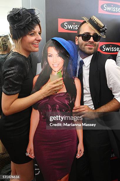 Zoe Badwi and friend pose with a cardboard cut-out of Kim Kardashian at the Swisse marquee during Emirates Stakes Day at Flemington Racecourse on...