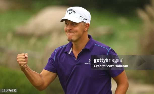 Fredrik Jacobson of Sweden celebrates a par saving putt on the eighth green during the third round of the WGC-HSBC Champions at Sheshan International...