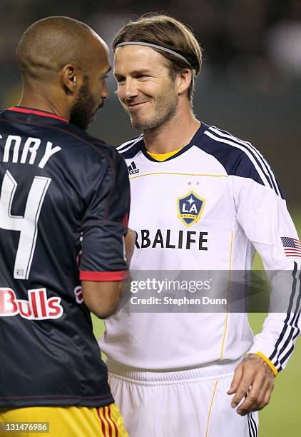 Thierry Henry of the New York Red Bulls and David Beckham of the Los Angeles Galaxy shake hands before playing in their Western Conference Semifinal...