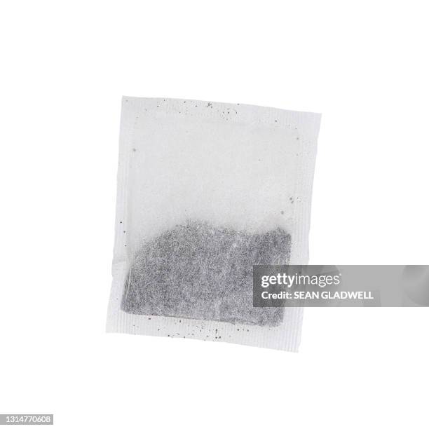 teabag on white background - tea bags stock-fotos und bilder