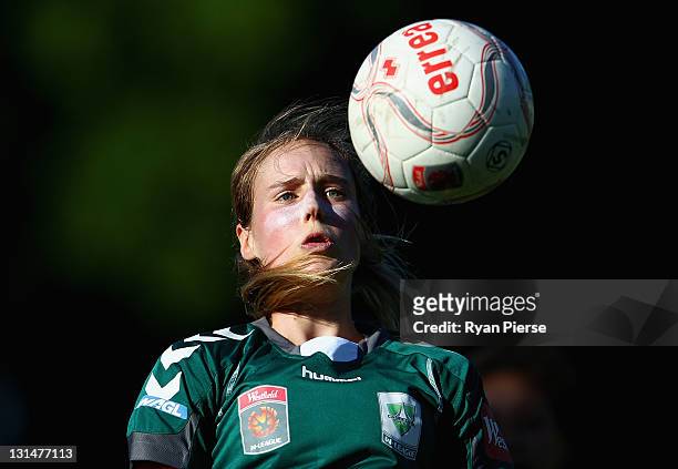Ellyse Perry of Canberra heads the ball during the round three W-League match between Sydney FC and Canberra United at Leichhardt Oval on November 5,...