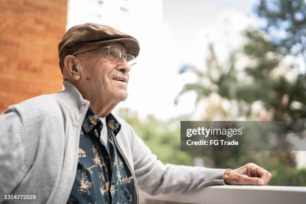 senior man contemplating at home - bereit stock pictures, royalty-free photos & images