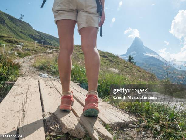 low section shot of woman hiking in switzerland - valais canton stock pictures, royalty-free photos & images